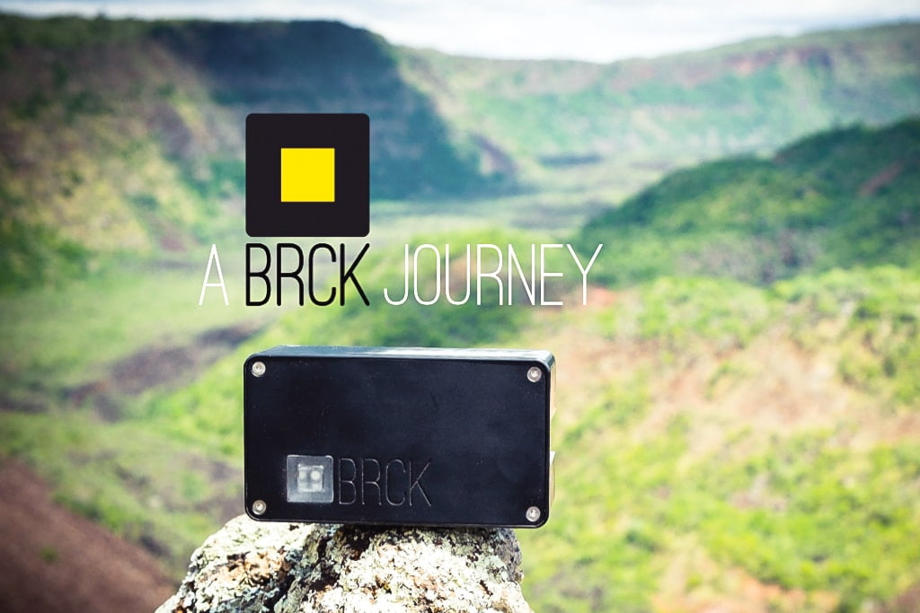 BRCK internet device balancing on a rock in Africa with Rift Valley mountains in the background.