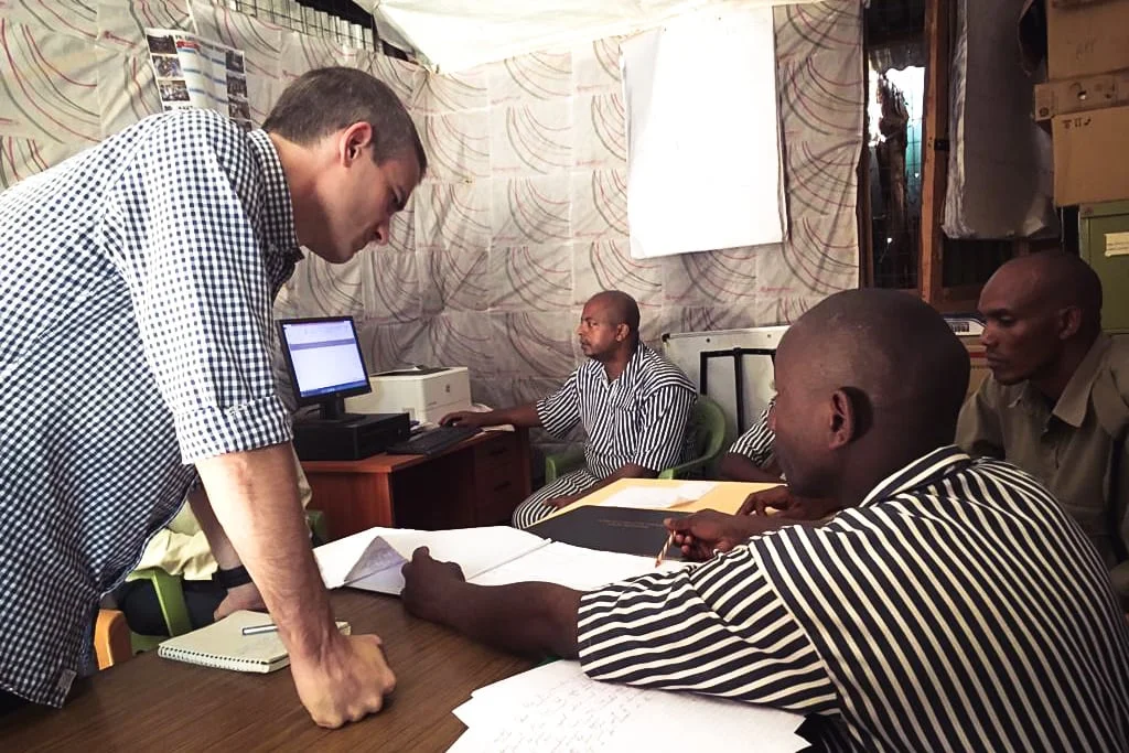 Mighty Ally Co-founder and CEO Kevin Brown conducting stakeholder interviews with prisoners in Kenya and Uganda for Justice Defenders