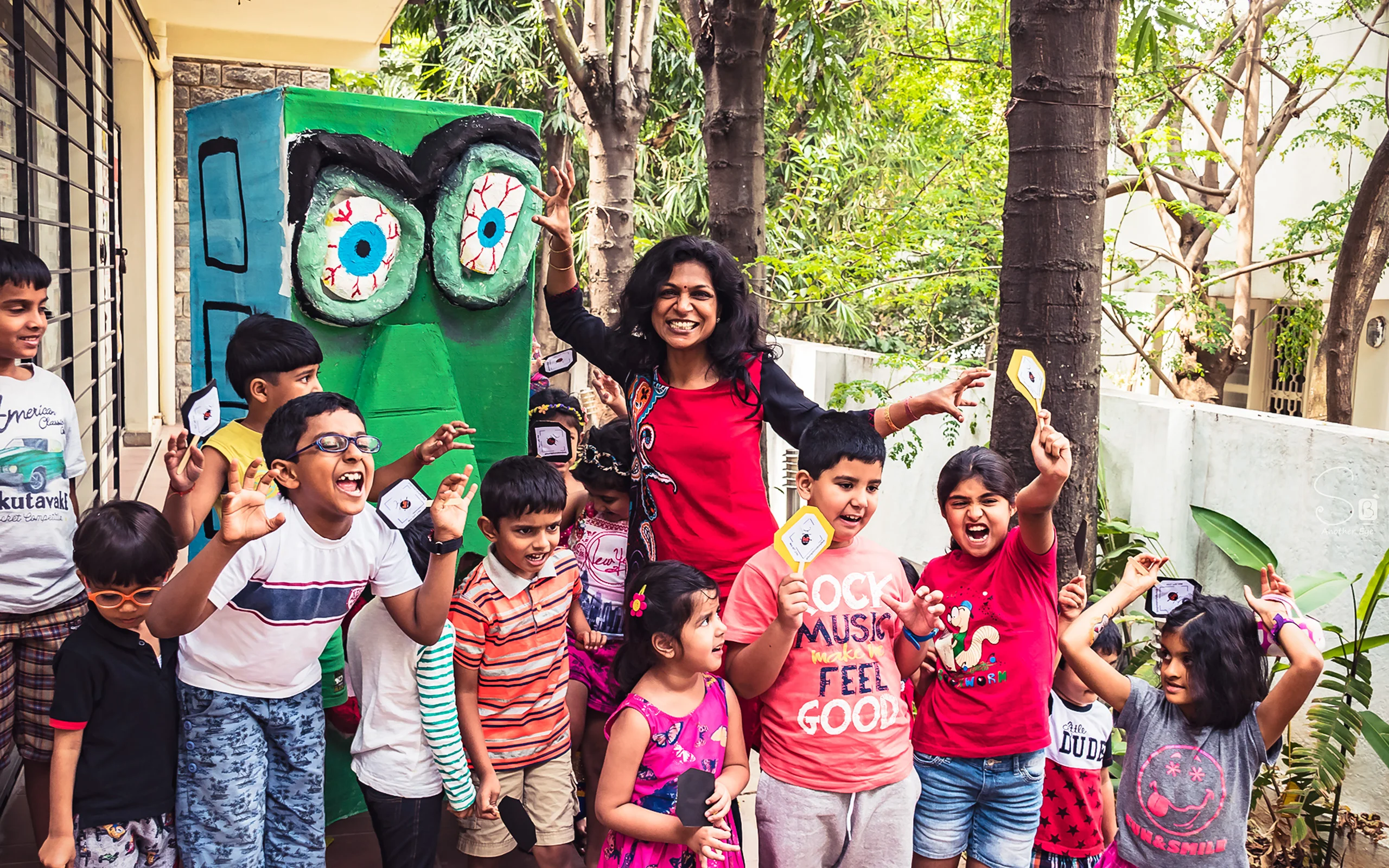 Aparna Athreya, storyteller and life skills coach, standing with a group of children from her educational company Kid and Parent Foundation