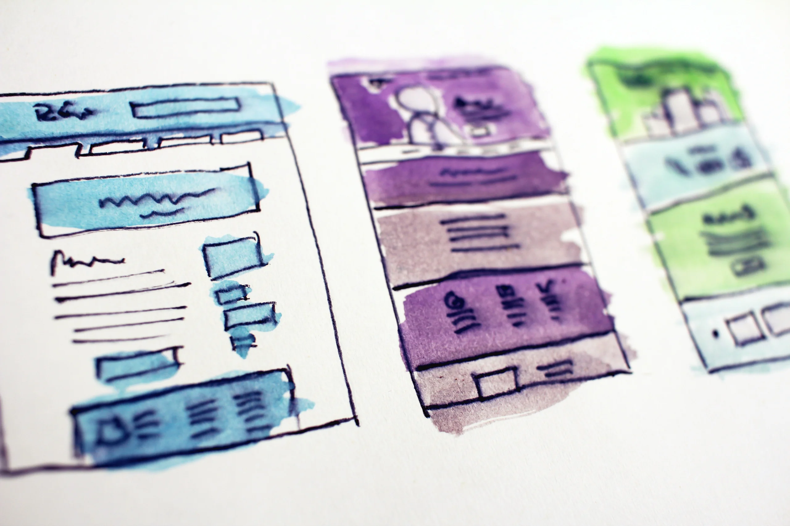 Three hand-sketched and watercolor-painted columns of website wireframes.