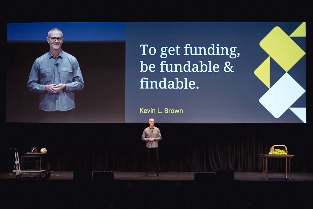 MIGHTY ALLY CEO Kevin L. Brown on stage at the NIO Summit for his keynote speech: To get funding, be fundable & findable.